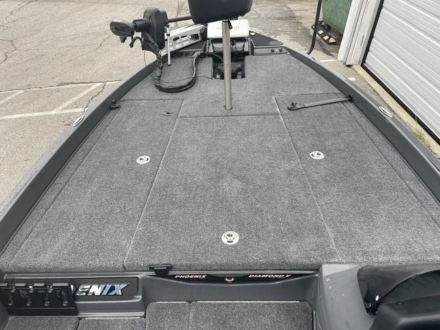 Slide: The Image of 2025 Phoenix 721 ZXL boat deck with gray carpet and fishing seat. - 11