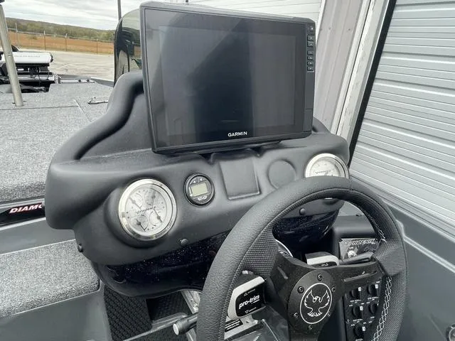 Slide: The Image of Dashboard of 2025 Phoenix 721 ZXL boat with Garmin display and steering wheel. - 16
