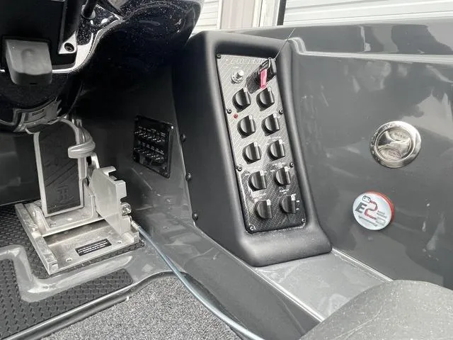 Slide: The Image of 2025 Phoenix 721 ZXL boat dashboard with control panel and foot pedal. - 18