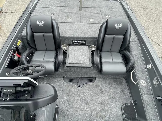 Slide: The Image of 2025 Phoenix 721 ZXL boat interior with dual seats and Garmin navigation system. - 19