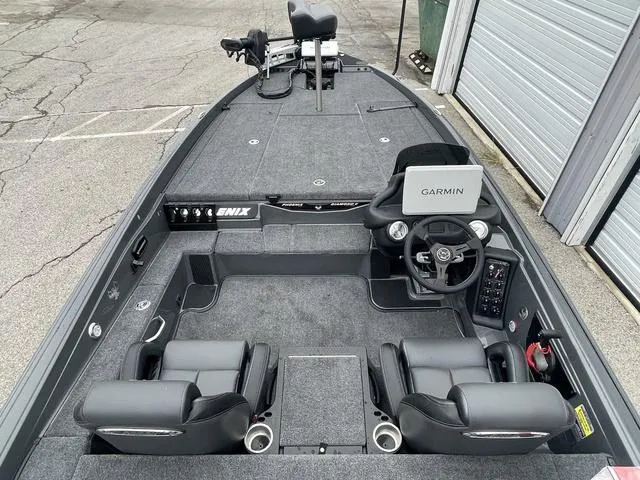 Slide: The Image of 2025 Phoenix 721 ZXL boat interior with Garmin system, dual seats, and spacious deck. - 22
