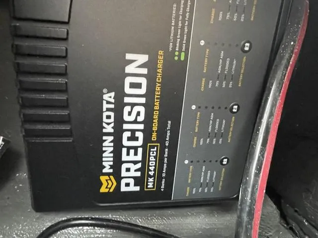 Slide: The Image of Minn Kota Precision MK 440PCL on-board battery charger in Phoenix 721 ZXL, 2025 model. - 24