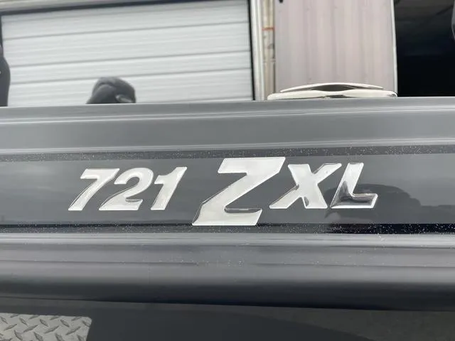 Slide: The Image of Close-up of 2025 Phoenix 721 ZXL model emblem on a vehicle. - 4