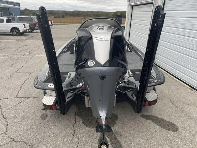 Slide: The Image of 2025 Phoenix 721 ZXL boat with powerful 250 engine, parked near garage. - 5