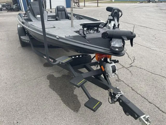 Slide: The Image of 2025 Phoenix 721 ZXL fishing boat on trailer, parked on pavement. - 8
