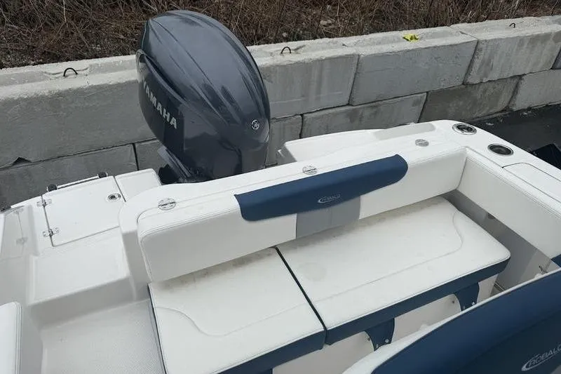 Slide: The Image of 2025 Robalo R 202 EX boat with Yamaha engine, featuring white and blue seating. - 11