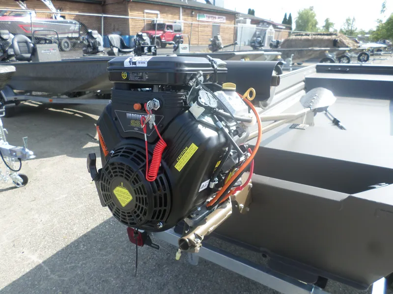 Slide: The Image of 2025 Alweld 1542 Marsh Jon boat with powerful engine, displayed outdoors. - 4