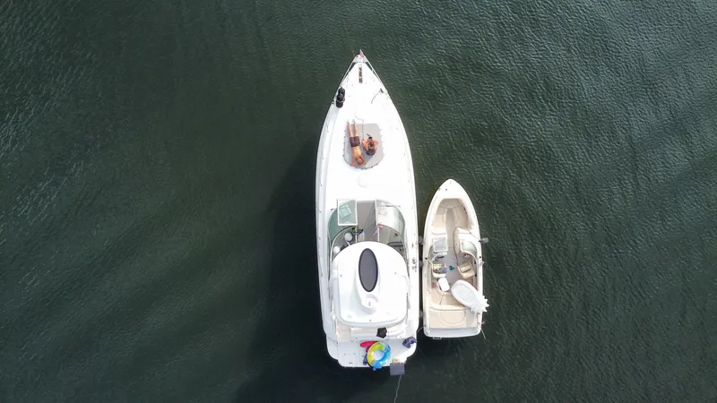 Slide: The Image of 2006 Cruisers Yachts 420 Express with small boat, aerial view on water. - 16