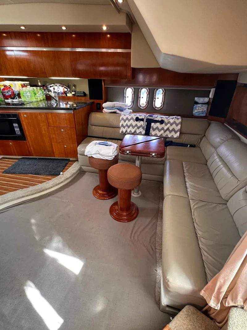 Slide: The Image of Luxurious 2006 Cruisers Yachts 420 Express interior with leather seating and modern kitchen. - 24