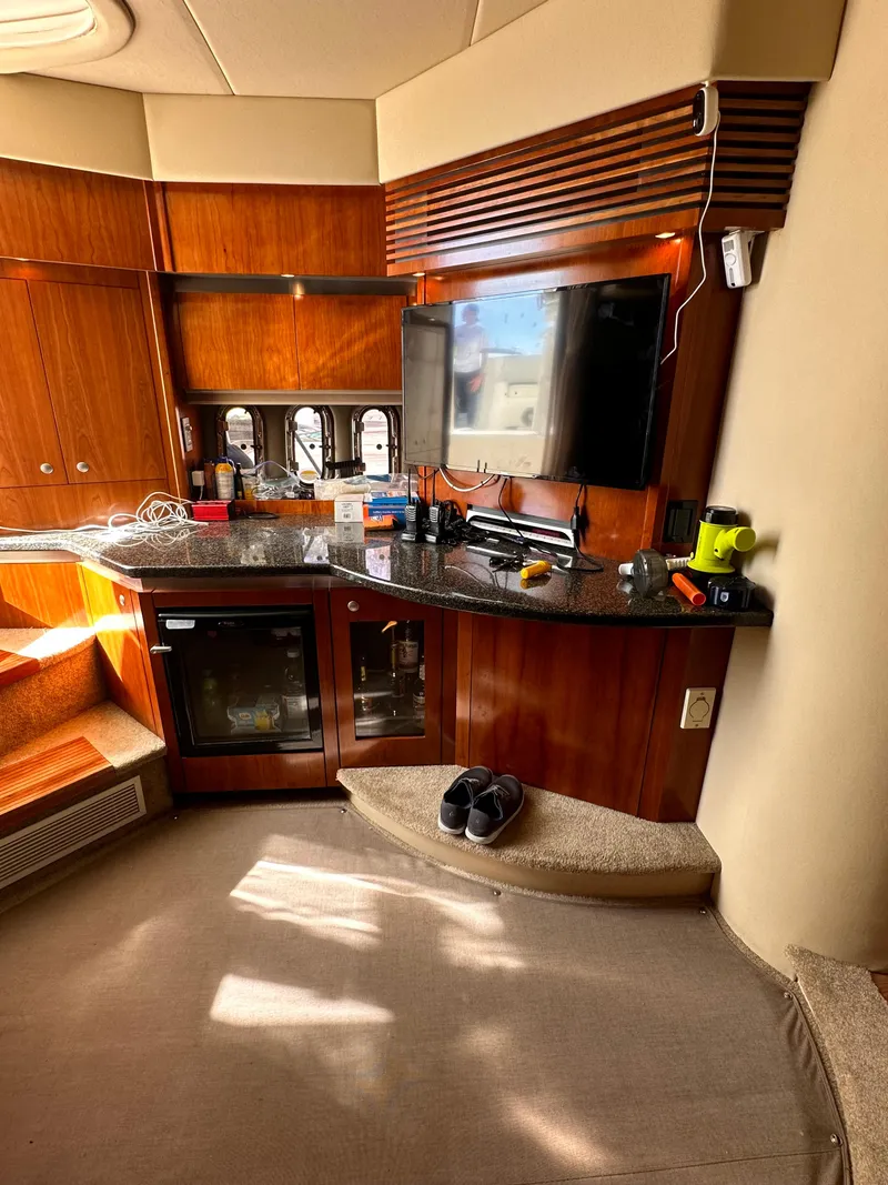 Slide: The Image of Interior of 2006 Cruisers Yachts 420 Express with wood cabinetry and modern amenities. - 30