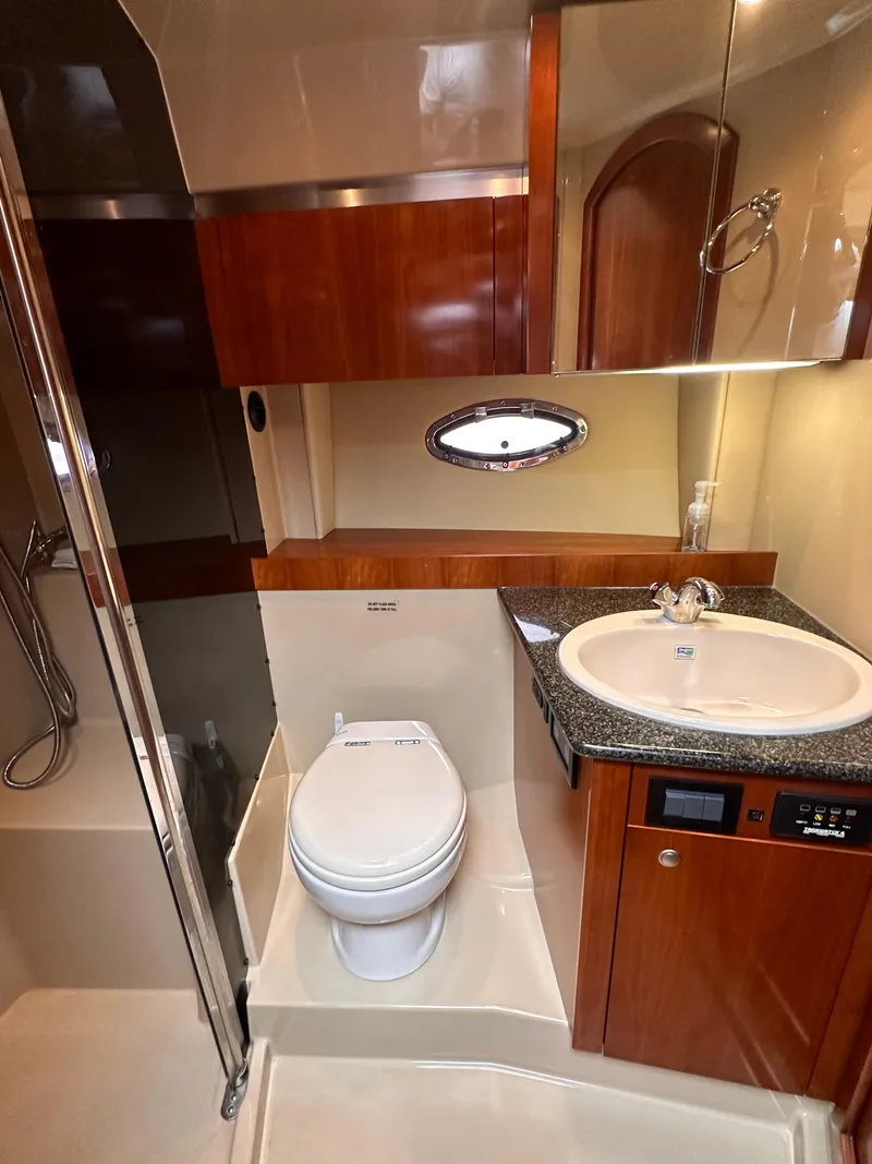 Slide: The Image of 2006 Cruisers Yachts 420 Express bathroom with shower, sink, and toilet. - 38