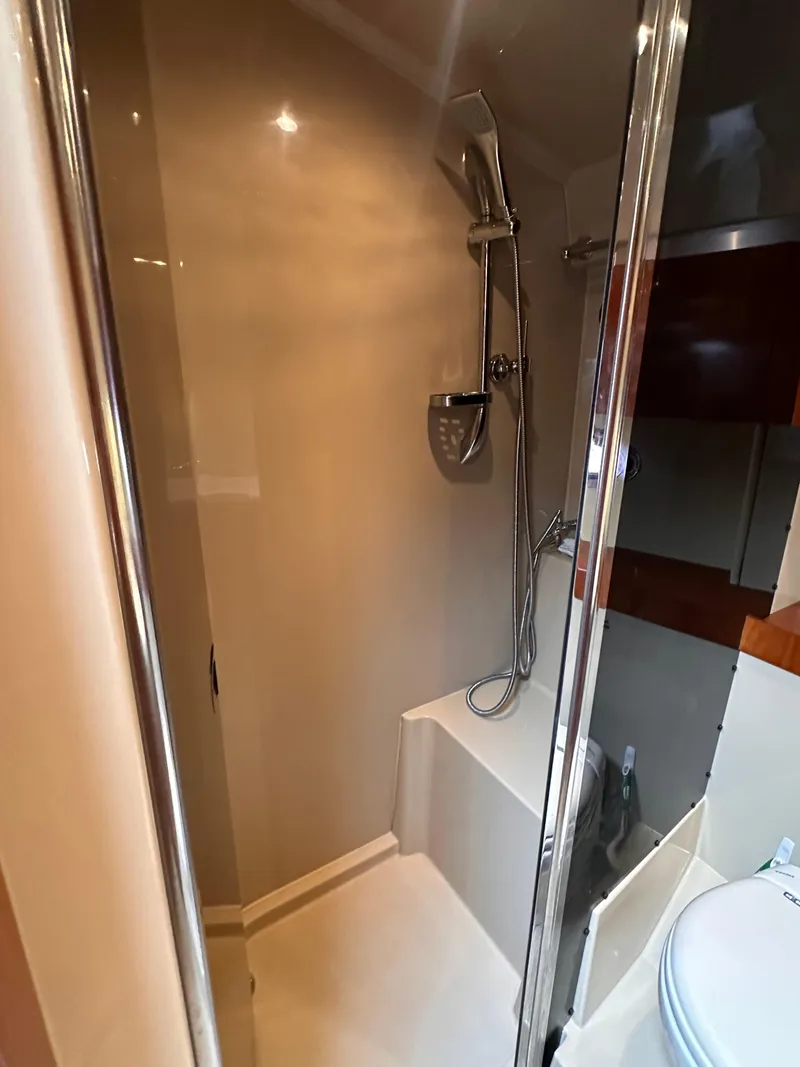Slide: The Image of 2006 Cruisers Yachts 420 Express bathroom with modern shower and sleek design. - 40