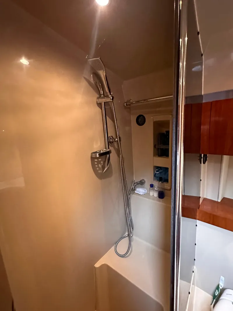 Slide: The Image of 2006 Cruisers Yachts 420 Express bathroom with modern shower and sleek design. - 41