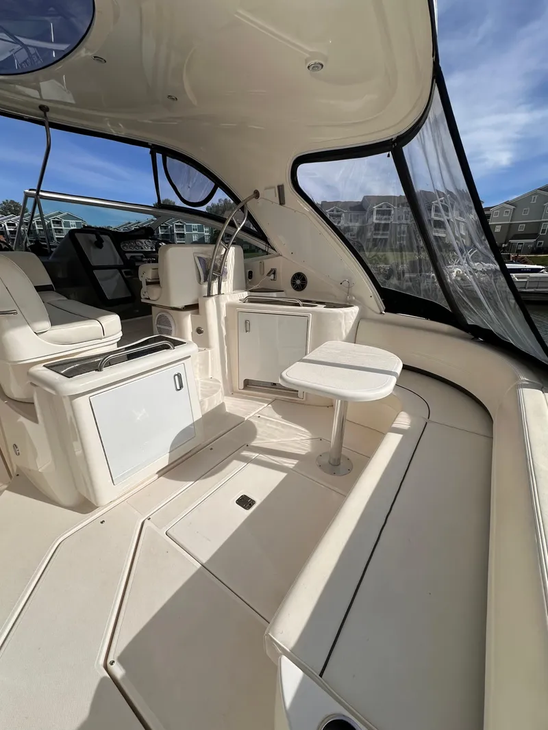 Slide: The Image of 2006 Cruisers Yachts 420 Express interior with seating and helm, featuring modern design. - 5
