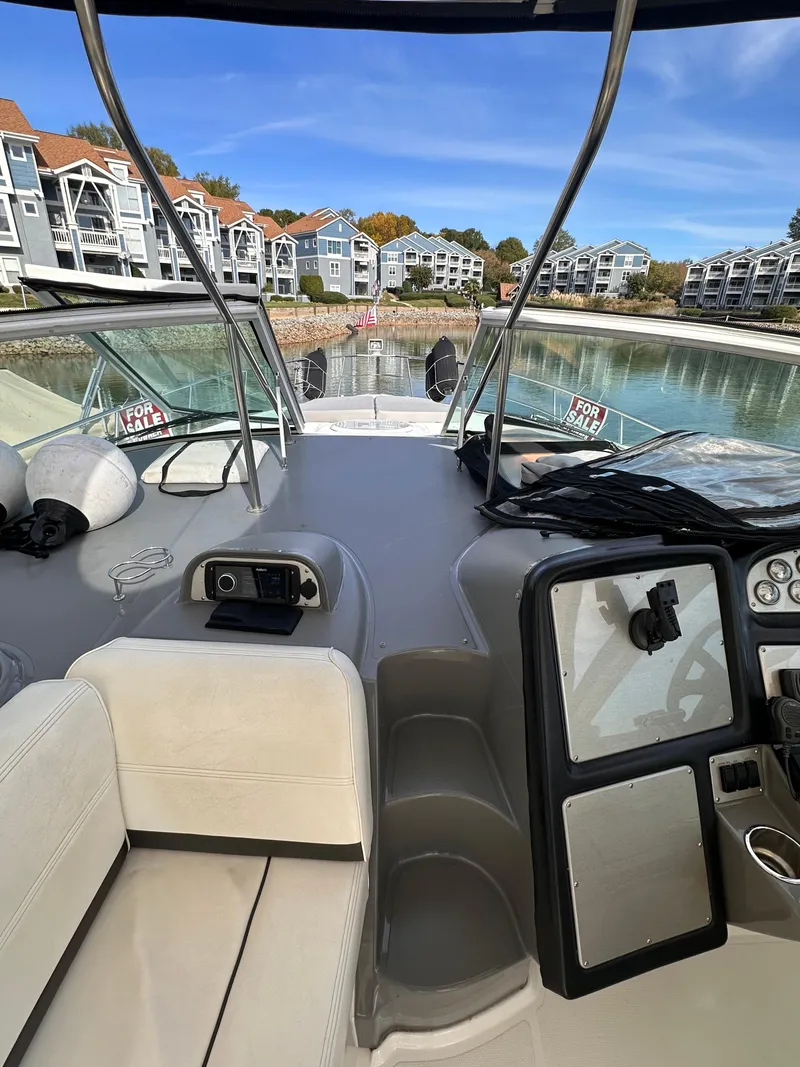 Slide: The Image of 2006 Cruisers Yachts 420 Express interior with waterfront view and modern amenities. - 9
