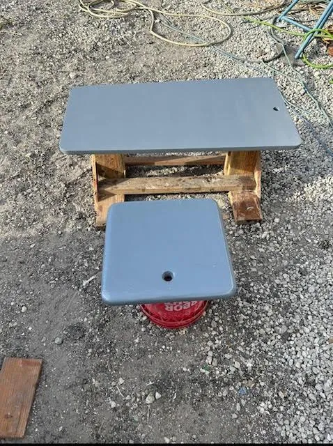 Slide: The Image of Gray panels from a 1969 Webbers Cove 39 boat on gravel surface. - 11