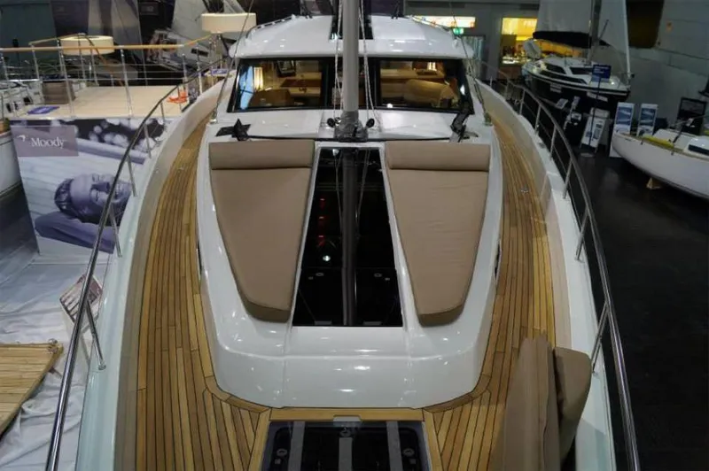 Slide: The Image of 2025 Moody 54 DS yacht with sleek deck design and luxurious seating. - 10