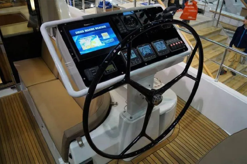 Slide: The Image of Steering wheel and navigation controls of 2025 Moody 54 DS yacht. - 11
