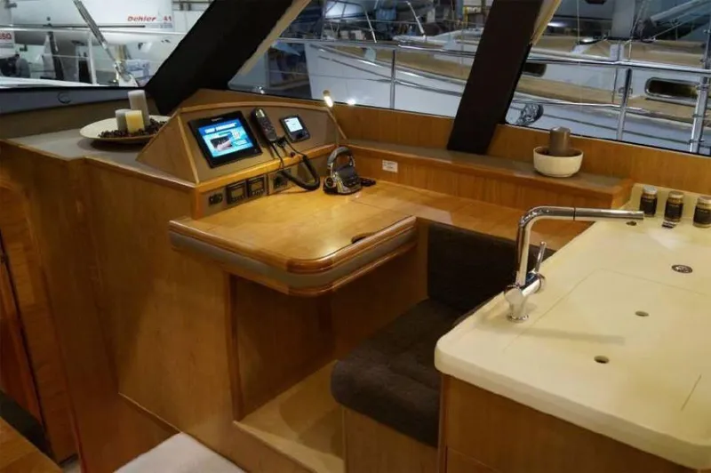 Slide: The Image of Modern interior of 2025 Moody 54 DS yacht with navigation equipment and sleek design. - 18