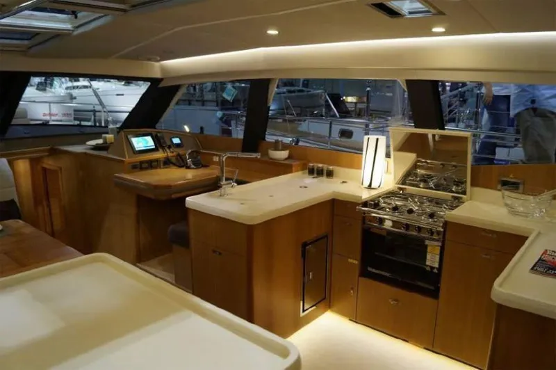 Slide: The Image of Luxurious interior of 2025 Moody 54 DS yacht with modern kitchen and navigation area. - 20