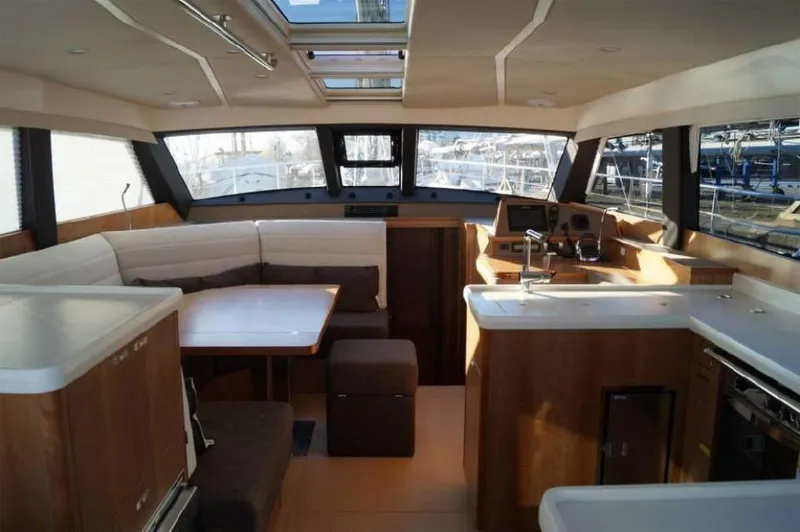 Slide: The Image of Luxurious interior of 2025 Moody 54 DS yacht with modern kitchen and seating area. - 21