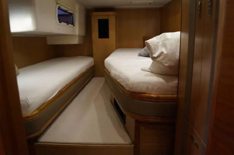 Slide: The Image of Luxurious cabin interior of 2025 Moody 54 DS yacht with twin beds. - 29