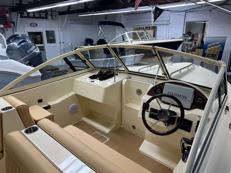 Slide: The Image of 2025 Rossiter 20 Day Boat interior with Garmin navigation system in showroom. - 11