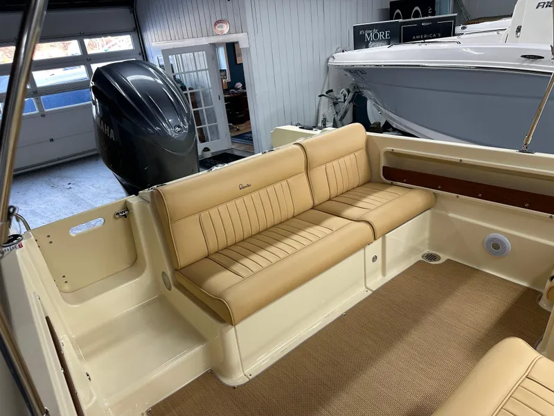 Slide: The Image of 2025 Rossiter 20 Day Boat interior with tan seating and spacious layout. - 12