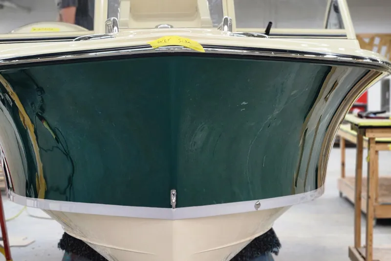 Slide: The Image of Front view of 2025 Rossiter 20 Day Boat in a workshop setting. - 14