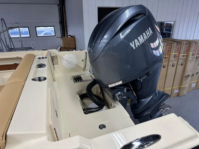Slide: The Image of 2025 Rossiter 20 Day Boat with Yamaha outboard motor in a showroom. - 8
