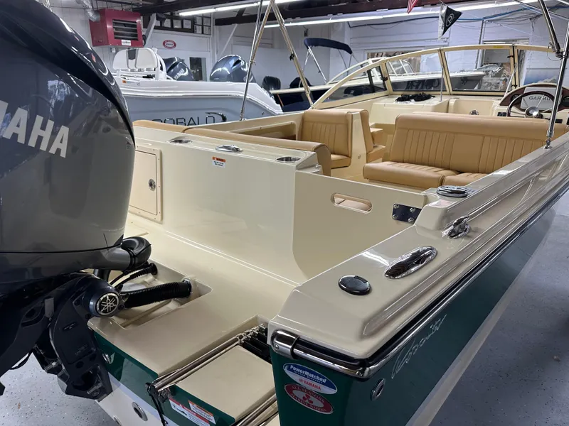 Slide: The Image of 2025 Rossiter 20 Day Boat with Yamaha engine, beige interior, in showroom. - 9