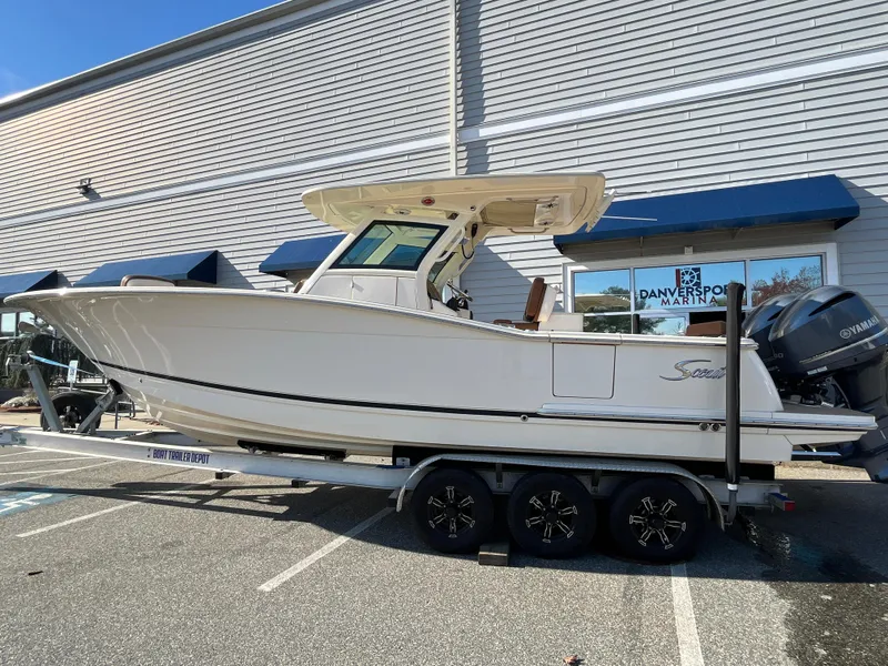 The Image of 2021 Scout 305 LXF boat on trailer outside Danversport Marina. - 0