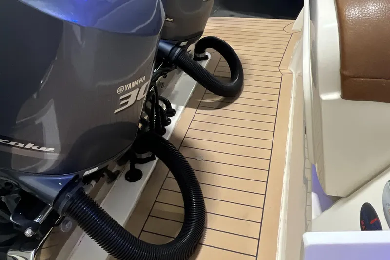 Slide: The Image of 2021 Scout 305 LXF boat with Yamaha 300 outboard engines, teak deck. - 10