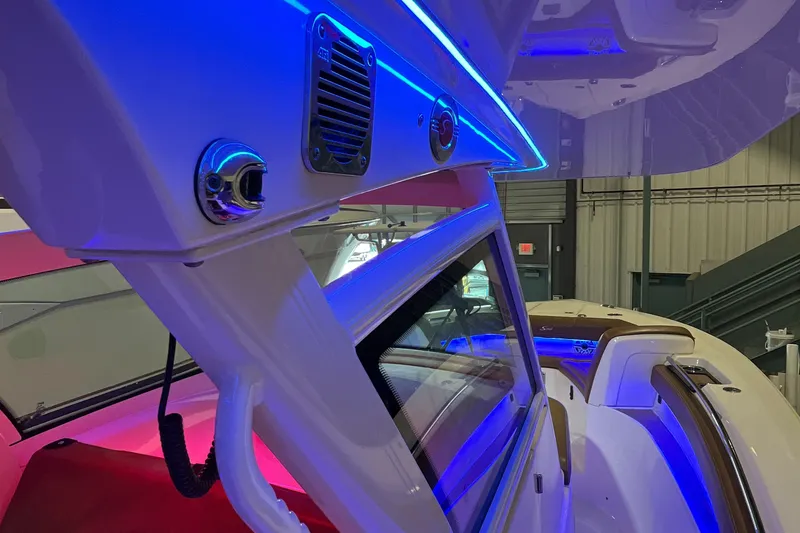 Slide: The Image of 2021 Scout 305 LXF boat interior with vibrant blue LED lighting. - 20