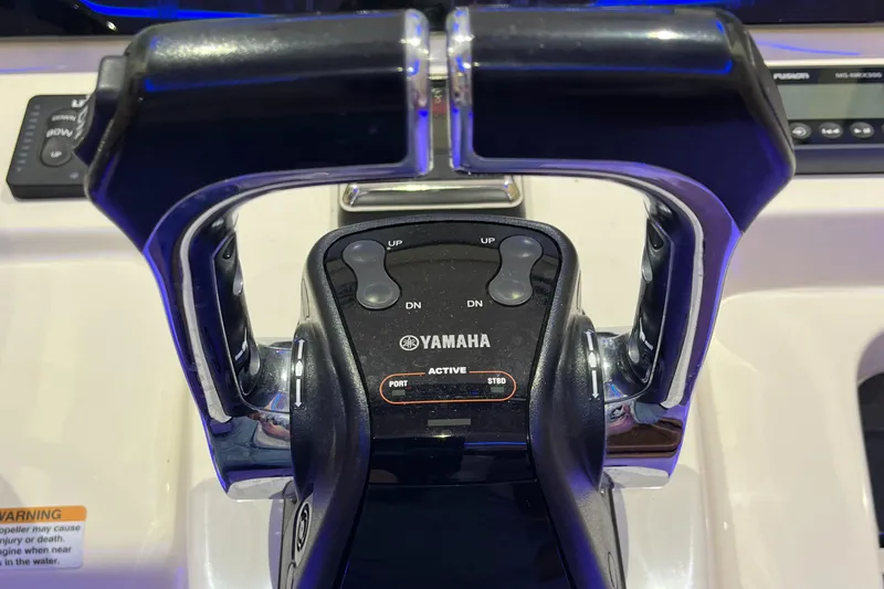 Slide: The Image of Yamaha throttle controls on 2021 Scout 305 LXF boat dashboard. - 33