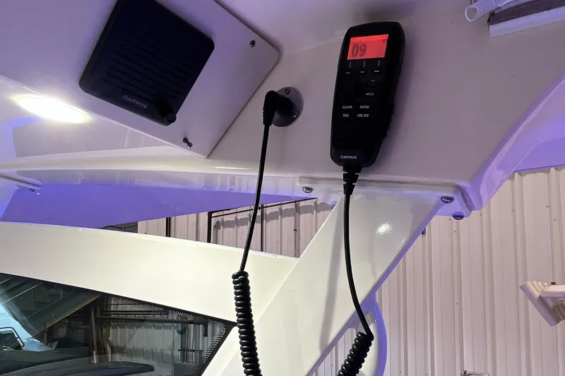 Slide: The Image of 2021 Scout 305 LXF boat interior with mounted radio and speaker. - 34