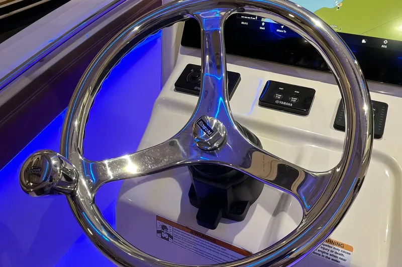 Slide: The Image of Steering wheel of 2021 Scout 305 LXF boat with illuminated dashboard. - 35