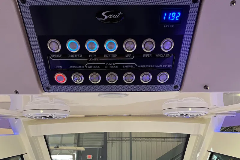 Slide: The Image of Control panel of 2021 Scout 305 LXF boat with illuminated buttons. - 36