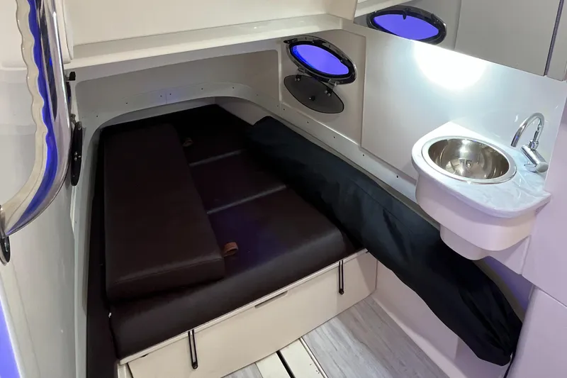 Slide: The Image of 2021 Scout 305 LXF cabin interior with bed and sink. - 43