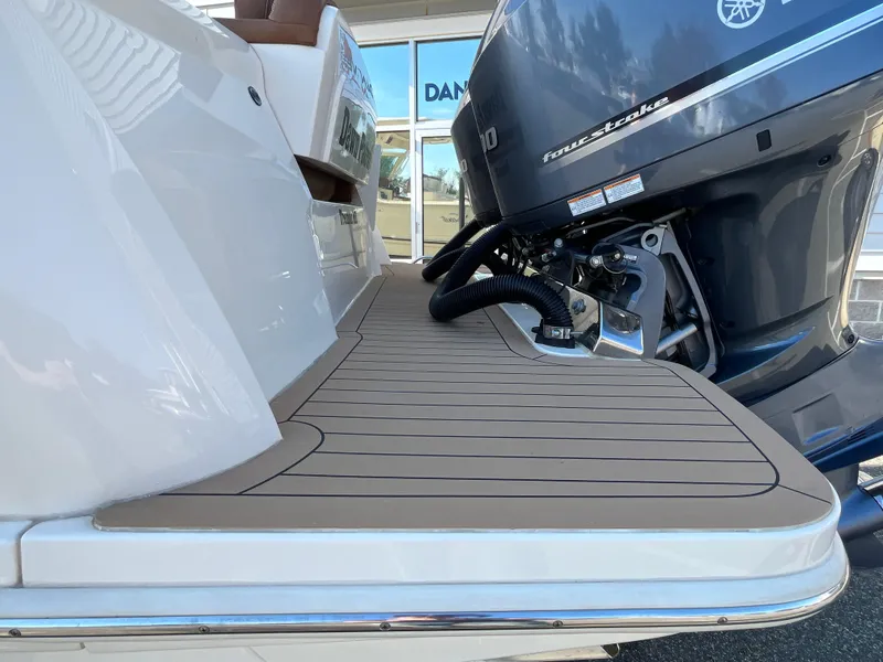 Slide: The Image of 2021 Scout 305 LXF boat with Yamaha outboard motor, teak deck detail. - 9