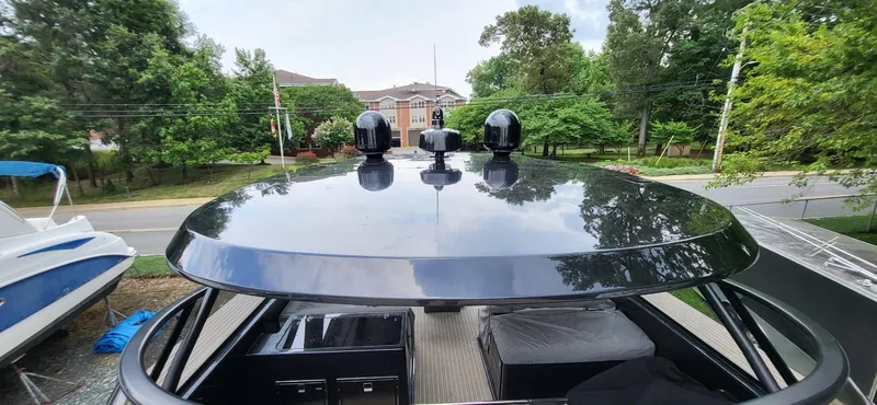 Slide: The Image of VanDutch 56 yacht interior storage compartments, 2023 model, featuring sleek black design. - 12