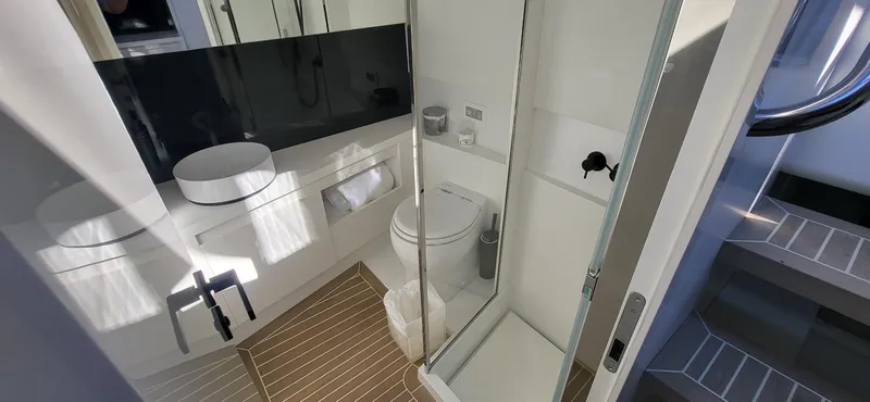 Slide: The Image of Luxurious interior of 2023 VanDutch 56 yacht with modern seating and ambient lighting. - 17