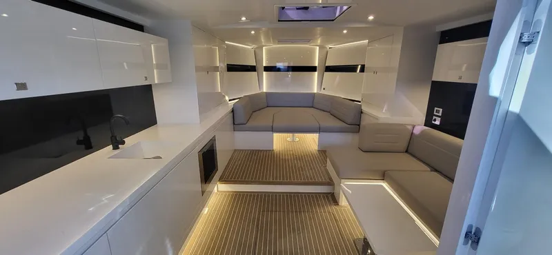 Slide: The Image of Luxurious interior of 2023 VanDutch 56 yacht with elegant seating and ambient lighting. - 18
