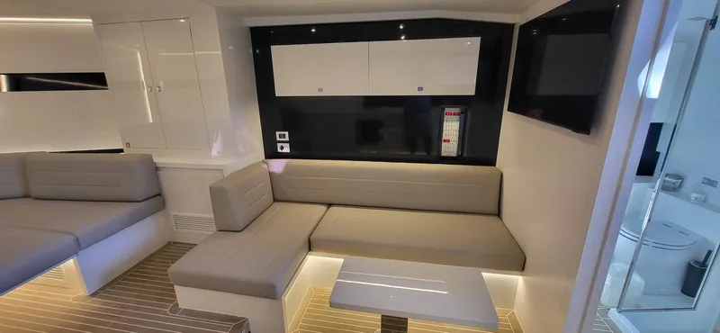 Slide: The Image of Luxurious interior of 2023 VanDutch 56 yacht with modern seating and sleek design. - 20