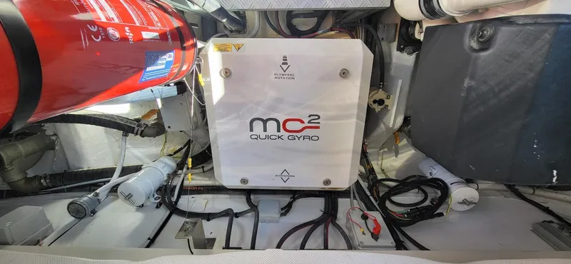 Slide: The Image of Luxurious interior of 2023 VanDutch 56 yacht with sleek white cabinetry and modern fixtures. - 26