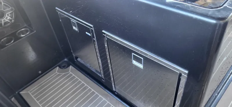 Slide: The Image of Engine compartment of 2023 VanDutch 56 yacht, showcasing dual engines and mechanical components. - 34