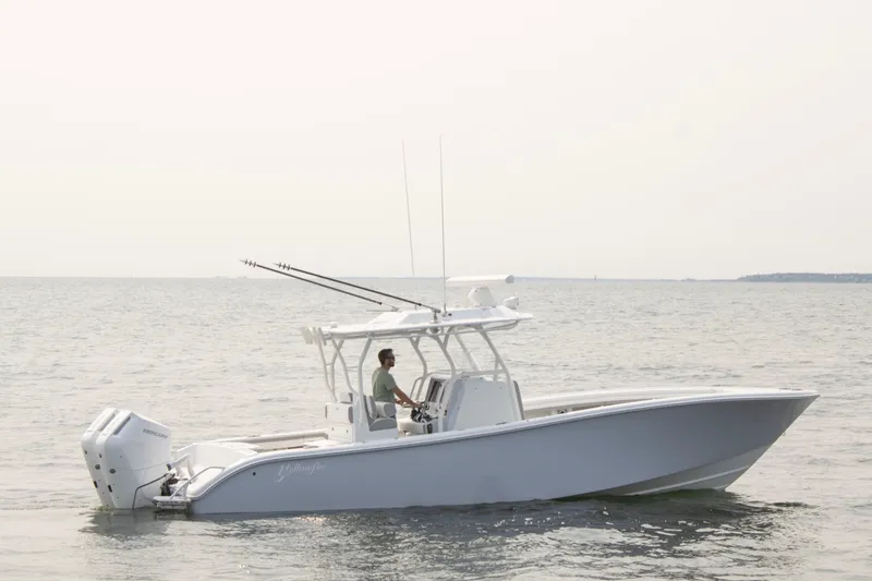 Slide: The Image of 2025 Yellowfin 32 Offshore boat cruising on calm waters. - 0