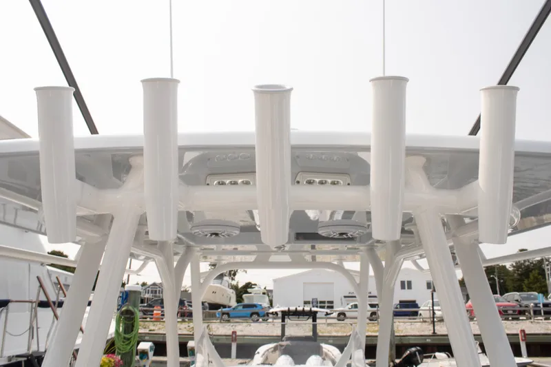 Slide: The Image of 2025 Yellowfin 32 Offshore boat with rod holders and overhead lighting. - 28