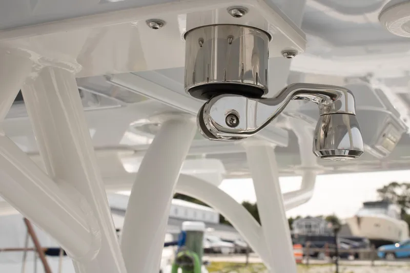 Slide: The Image of Close-up of a 2025 Yellowfin 32 Offshore boat's polished metal fixture. - 29