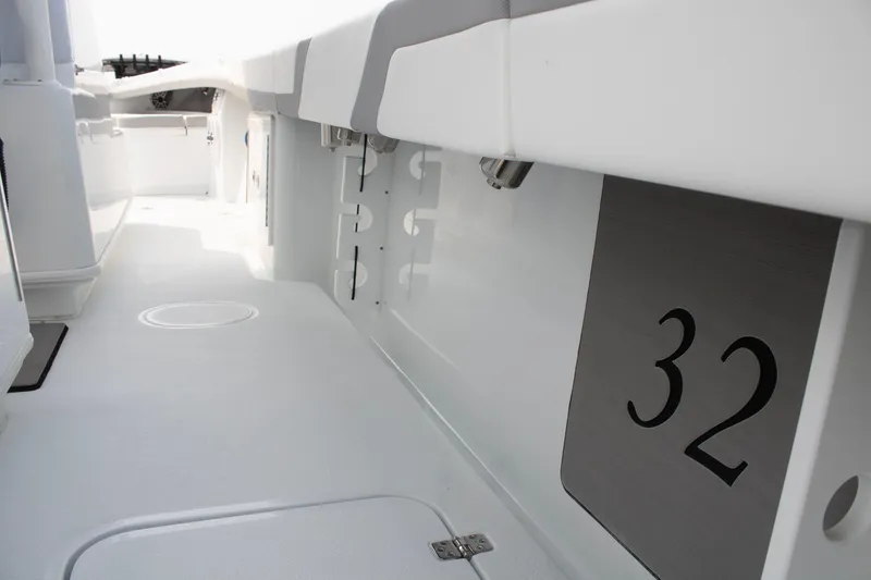 Slide: The Image of 2025 Yellowfin 32 Offshore boat interior, showcasing sleek white design and spacious layout. - 30